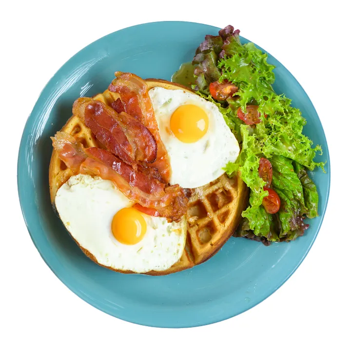 Ver foto de Dos huevos estrellados, miel, tocino crujiente y
bouquet de hojas orgánicas.
